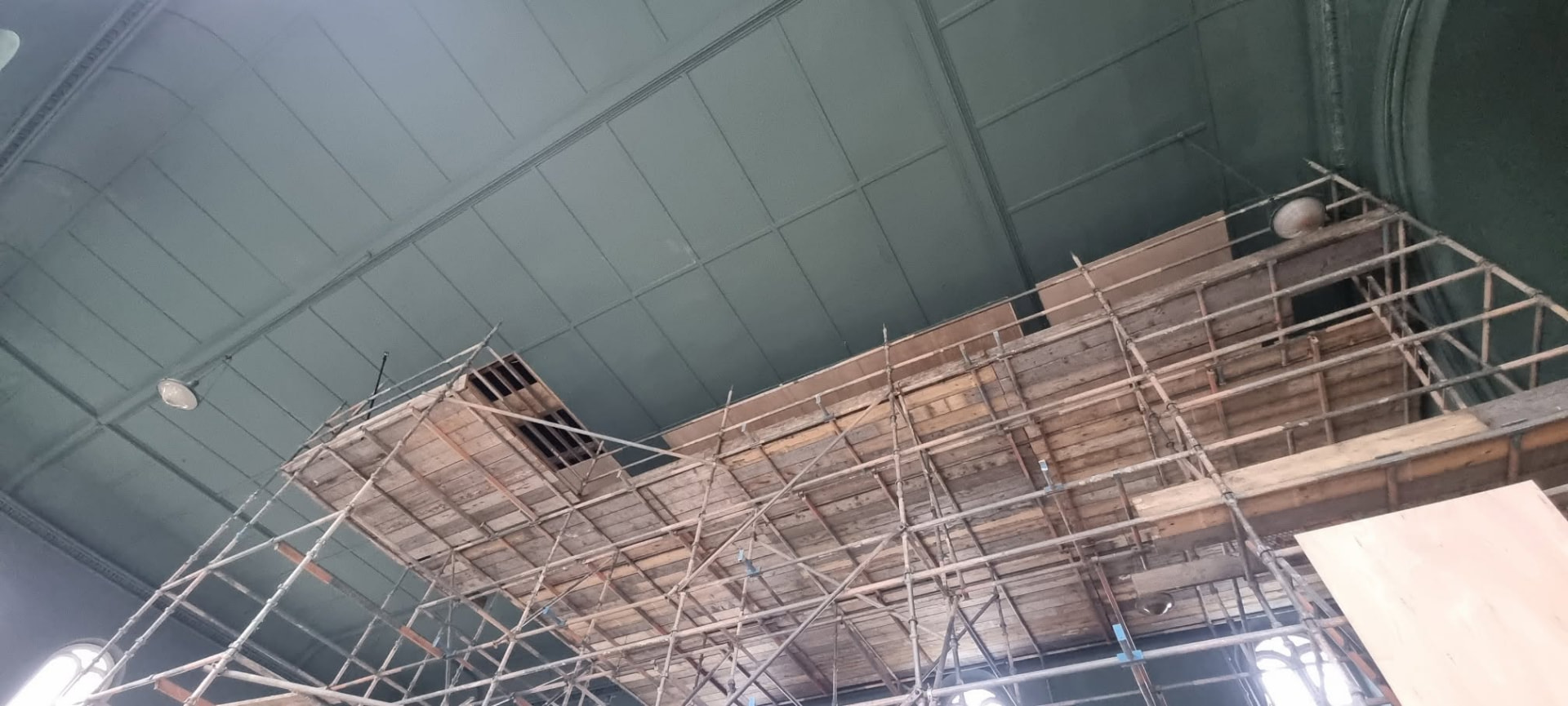 Scaffold deck erected at high level inside St Ouen's Methodist Church to reach the ceiling